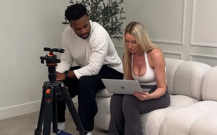 Setting up a tripod and reviewing shots during a studio content shoot