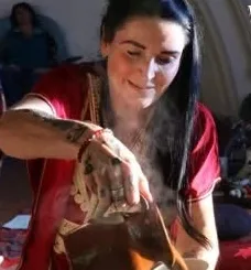 Host pouring tea at an event